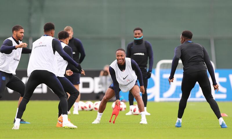 England's Raheem Sterling and teammates during the session. EPA