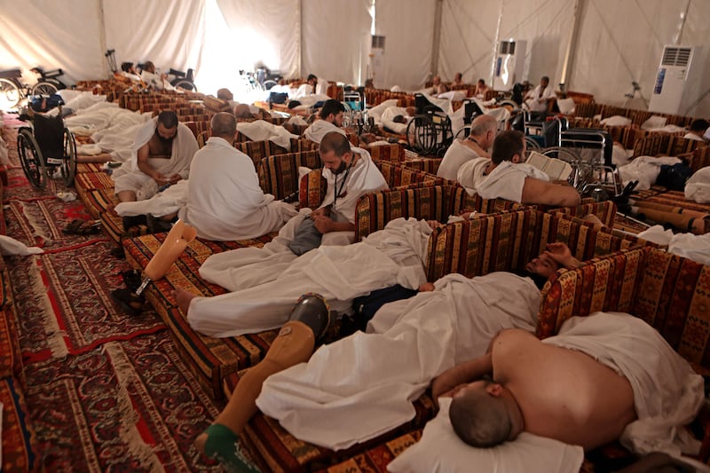Syrian amputees rest inside their tent near Mount Arafat. AFP