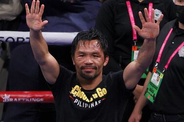 LAS VEGAS, NEVADA - AUGUST 21: Manny Pacquiao gestures to fans after his WBA welterweight title fight against Yordenis Ugas at T-Mobile Arena on August 21, 2021 in Las Vegas, Nevada.  Ugas retained his title in a unanimous decision.    Ethan Miller / Getty Images / AFP
