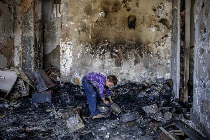 epa07747170 An Afghan child reacts as he stands in his damaged room in the neighboring building, in Kabul, Afghanistan, 29 July 2019, a day after a complex suicide attack followed by a fire fight against the office of Afghan former chief of intelligence and current candidate as the first voice president of Ashraf Ghani, in Kabul. According to reports, at least 20 people were killed and 50 others wounded in the incident which targeted the office of Amrullah Saleh.  EPA/HEDAYATULLAH AMID