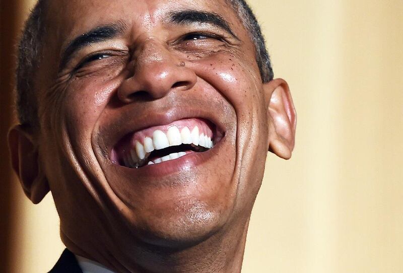 US president Barack Obama laughs as he listens to actor Joel McHale tell jokes. Jewel Samad / AFP photo