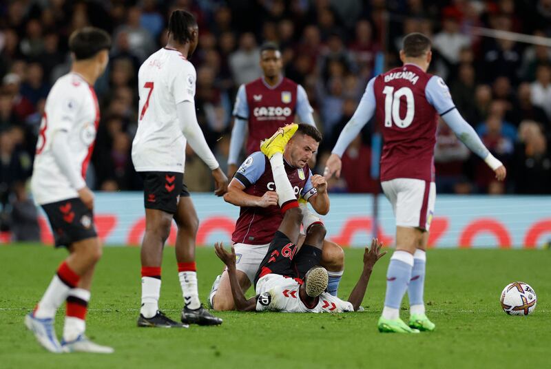 Aston Villa's John McGinn with Southampton's Moussa Djenepo. Reuters