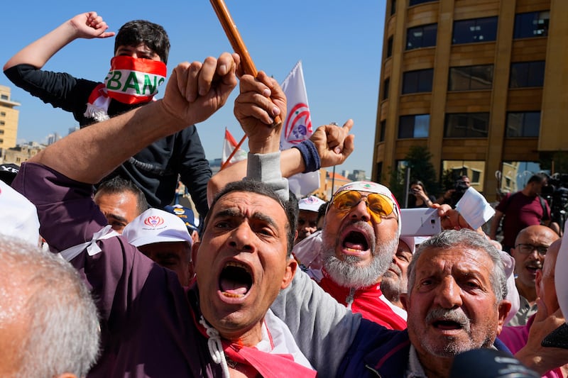 Protesters shout slogans. AP Photo 