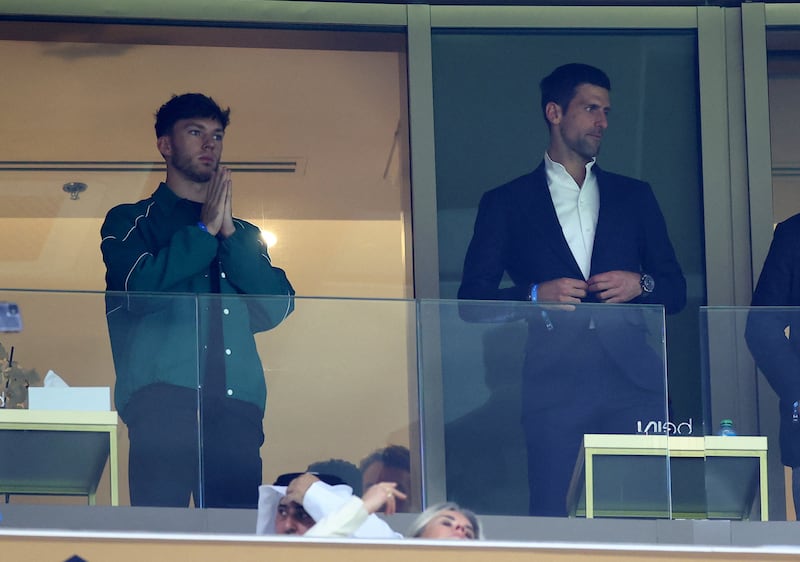 Formula One driver Pierre Gasly and tennis great Novak Djokovic during the World Cup final in Qatar. Reuters