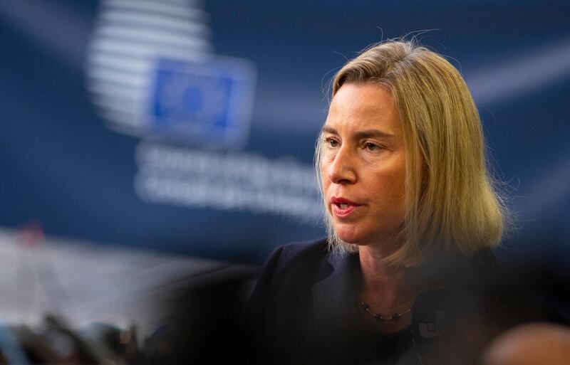 European Union foreign policy chief Federica Mogherini speaks with the media as she arrives for a meeting of EU foreign ministers at the European Convention Center in Luxembourg, Monday, Oct. 14, 2019. Some European Union nations are looking to extend moves against Turkey by getting more nations to ban arms exports to Ankara to protest the offensive in neighboring Syria. (AP Photo/Virginia Mayo)