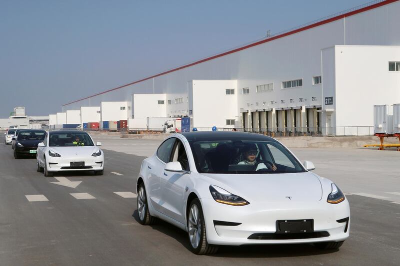 FILE PHOTO: China-made Tesla Model 3 vehicles are seen at the Shanghai Gigafactory of the U.S. electric car maker in Shanghai, China December 30, 2019.  REUTERS/Yilei Sun - RC2I5E9LQORA/File Photo