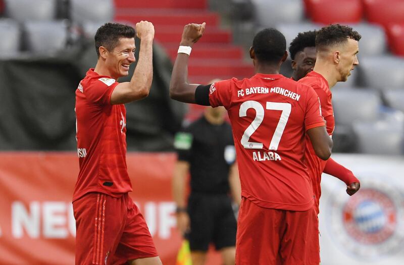 Robert Lewandowski celebrates scoring Bayern's third goal with David Alaba. Reuters