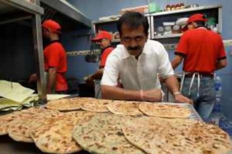 
DUBAI, UNITED ARAB EMIRATES – Nov 22: Pankaj Pathak owner of Paratha King restaurant in Karama, Dubai. (Pawan Singh / The National) *** Local Caption ***  PS01- PARATHA KING.jpg