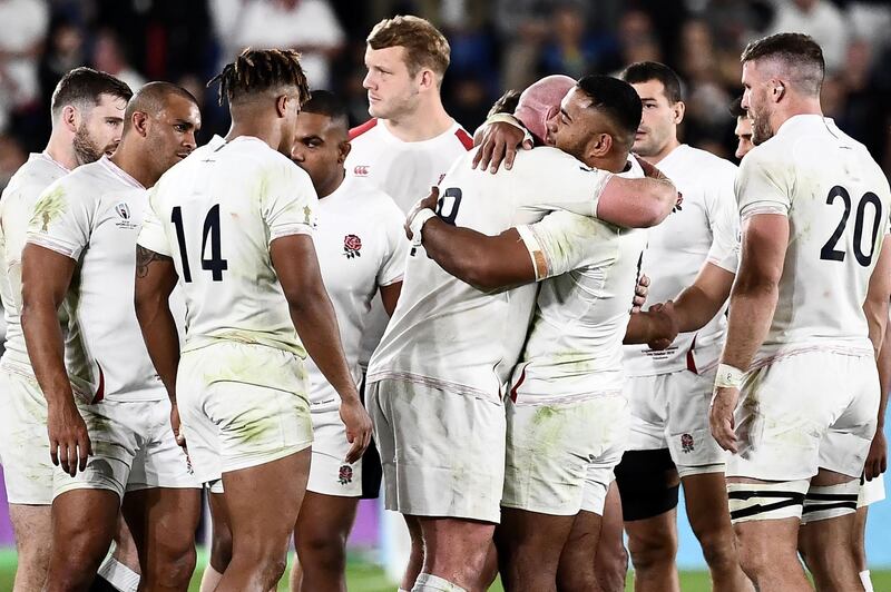 England's players celebrate after the Japan 2019 Rugby World Cup semi-final match between England and New Zealand at the International Stadium Yokohama in Yokohama on October 26, 2019. / AFP / Anne-Christine POUJOULAT

