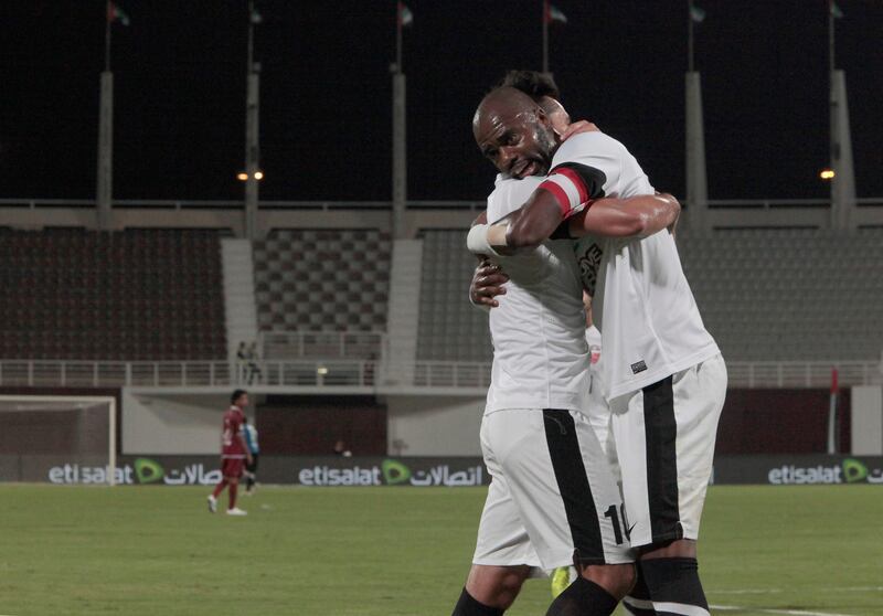 Abu Dhabi, United Arab Emirates - November 23, 2012.  ( Right to Left ) Batista Libano ( Al Ahli ) scores the first goal as he was hug by Luis Antonio Jiminez his teammate,  at the ongoing Etisalat Pro League.  ( Jeffrey E Biteng / The National )