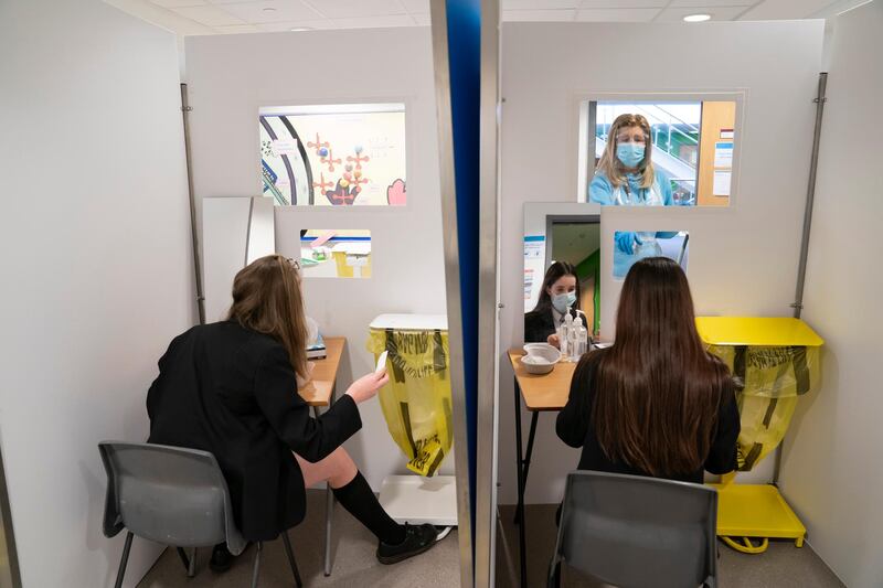 Students at Great Academy Ashton are taken through the Covid testing proceedure, as the school prepares for its reopening on March 8, in Ashton-Under-Lyne, England. AP Photo