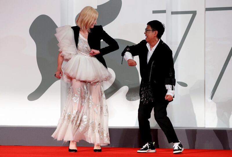 Cate Blanchett bumps elbows with director Ann Hui at 77th Venice Film Festival in Venice, Italy. Reuters