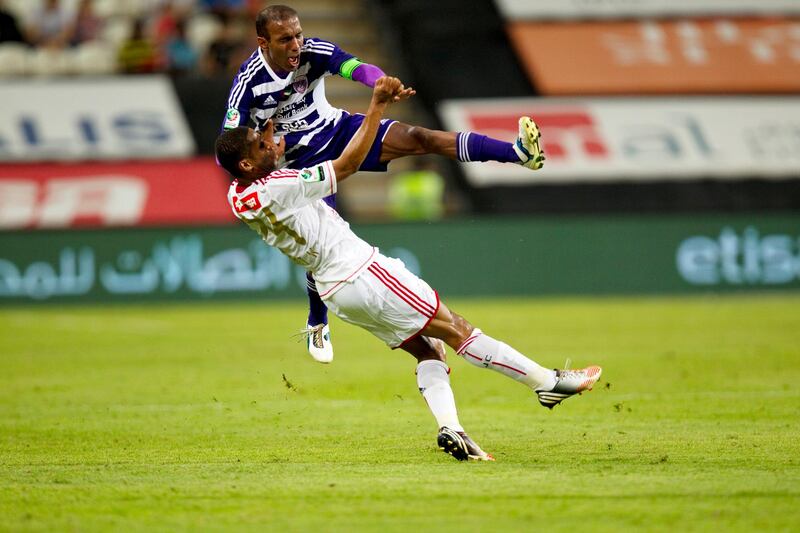 Abu Dhabi, United Arab Emirates, October 29, 2012:   Al Ain's Helal Saeed, top, and Al Jazira's Subait Khater collide during their Pro League match at Mohammad bin Zayed Stadium in Abu Dhabi on October 29, 2012. Christopher Pike / The National
