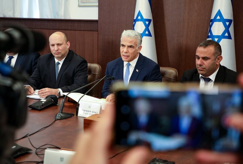 Israel's Prime Minister Yair Lapid and former prime minister Naftali Bennett attend a cabinet meeting in Jerusalem on July 31. Reuters