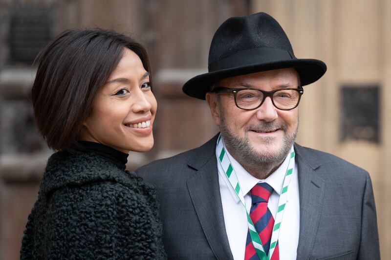 Mr Galloway and his wife Putri Gayatri Pertiwi outside the Houses of Parliament. PA