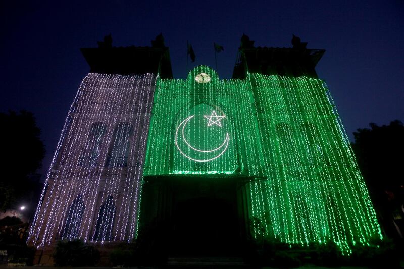 The Metropolitan building illuminated with Pakistan's national flag in Lahore, Pakistan. Reuters