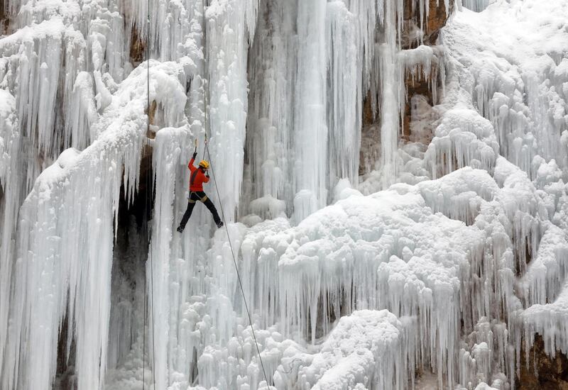 An Iranian ice climber scales an ice cliff and frozen waterfall at the Meygun ice climbing club, in the village of Meygun, northeast of the capital of Tehran, Iran. EPA
