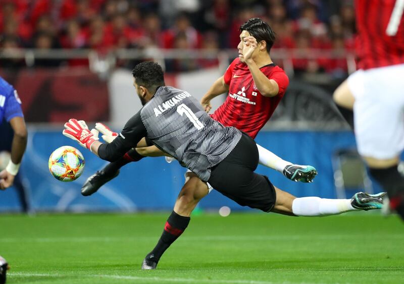 epa08022093 Saudi’s Al-Hilal goalkeeper Abdullah Al-Mayouf in action aginst Japan's Urawa Red Diamonds Daiki Hashioka (R) during the second leg of the AFC Champions League final soccer match between Urawa Red Diamonds and Al-Hilal in Saitama, north of Tokyo, Japan, 24 November 2019. Al-Hilal won the Asian club title.  EPA/JIJI PRESS JAPAN OUT EDITORIAL USE ONLY/  NO ARCHIVES