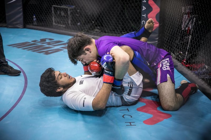 Emirati Jasem Al Hosani, white, in action against Joseph Bowers of USA. Photo: IMMAF