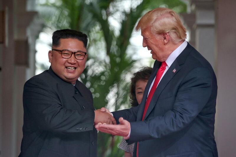 US President Donald Trump meets North Korean leader Kim Jong-un. Kevin Lim / Reuters