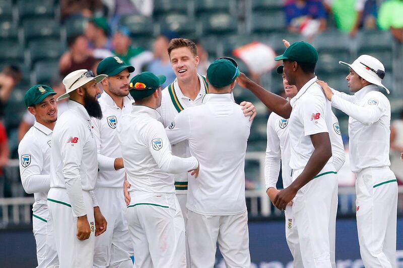 South African bowler Morne Morkel (C) celebrates the dismissal of Australian batsman Joe Burns (not in picture) on the fourth day of the fourth Test cricket match between South Africa and Australia won by South Africa at Wanderers cricket ground on April 2, 2018 in Johannesburg.   / AFP PHOTO / GIANLUIGI GUERCIA