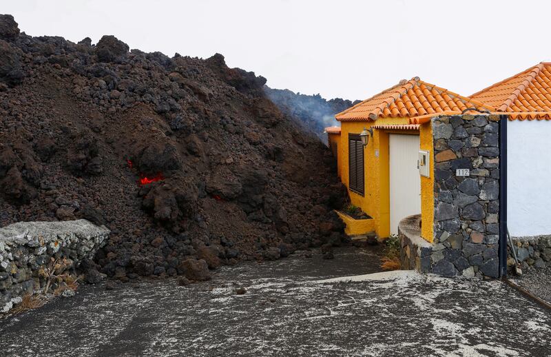 Lava reaches a house in La Palma's Cumbre Vieja National Park. Photo: Reuters