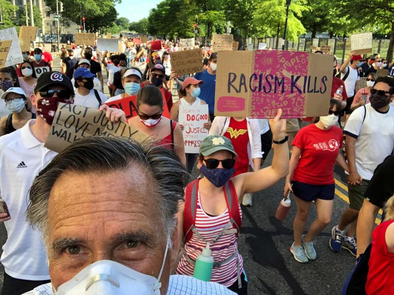 US senator Mitt Romney  marches during a protest against racial inequality in the aftermath of the death in Minneapolis police custody of George Floyd, in Washington DC.  Reuters