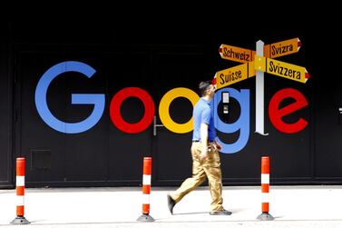 A man walks past a logo of Google in front of an office building in Zurich. Reuters