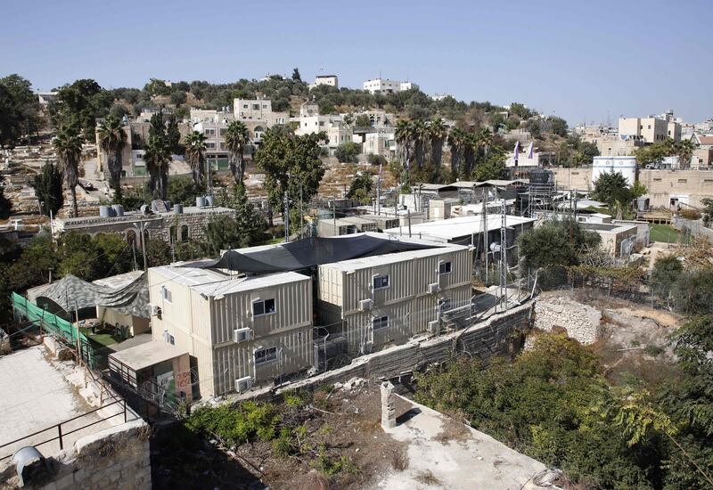 A picture shows on October 17,2017 structures at an Israeli army base in the centre of the divided city of Hebron in the occupied West Bank where 31 settlers house are going to be built. 
Israel approved permits for 31 settler homes in Hebron, the first such green light for the flashpoint West Bank city since 2002 and part of a major increase in settlement activity, NGO Peace now said. Several hundred Israeli settlers live in the heart of Hebron under heavy military guard among some 200,000 Palestinians. / AFP PHOTO / HAZEM BADER