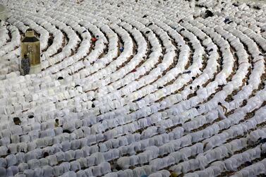 Muslims pray around the Kaaba, Islam's holiest shrine, at the Grand Mosque complex in the Saudi city of Mecca, during the fasting month of Ramadan, on April 9, 2022.  - Saudi Arabia said today it will permit one million Muslims from inside and outside the country to participate in this year's hajj, a sharp uptick after pandemic restrictions forced two years of drastically pared-down pilgrimages.  (Photo by Abdel Ghani BASHIR  /  AFP)