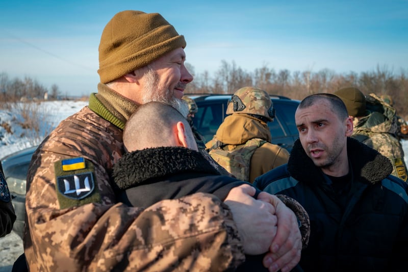 Ukrainian prisoners of war are received after a prisoner exchange at an undisclosed location in Ukraine. AP
