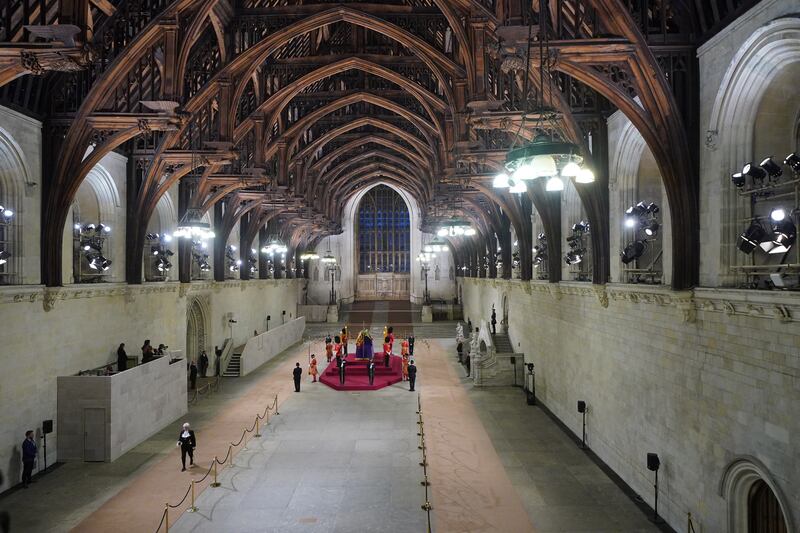 Black Rod, the House of Lords' senior figure, walks through Westminster Hall at 6.30am after paying her respects on the final day of the lying in state at the coffin of Queen Elizabeth II in London. PA