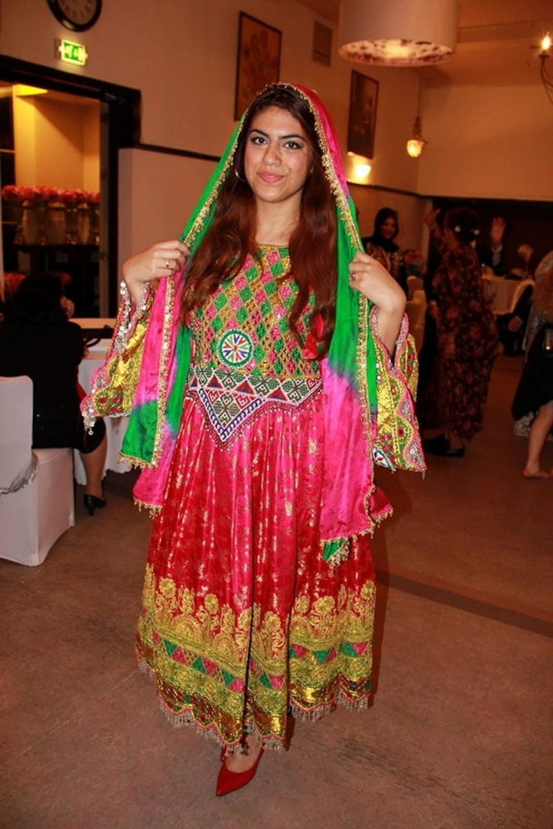 A woman poses in traditional Afghan attire, in Rotterdam, Netherlands, 2015, in this picture obtained from social media.  Sadaf Qutbyar/via Reuters