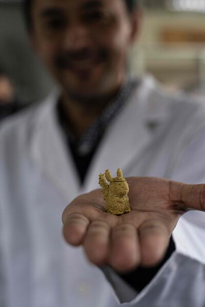 Roberto Lemus with a 3D-printed candy, in the shape of the Pokémon character Pikachu. AFP