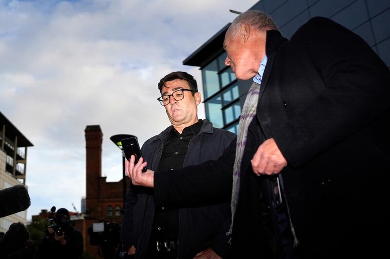 MANCHESTER, UNITED KINGDOM â€“ OCTOBER 20: Greater Manchester mayor Andy Burnham (left) with leader of Manchester City Council Sir Richard showing him the news from London when the Tier 3 measures will come into force on October 20, 2020 in Manchester, England. Talks between the Housing and Communities Minister, Robert Jenrick, and the Manchester Mayor, Andy Burnham, collapsed today after they failed to agree a financial package to help Mancunians whose jobs are threatened by a Tier Three lockdown.  (Photo by Christopher Furlong/Getty Images)