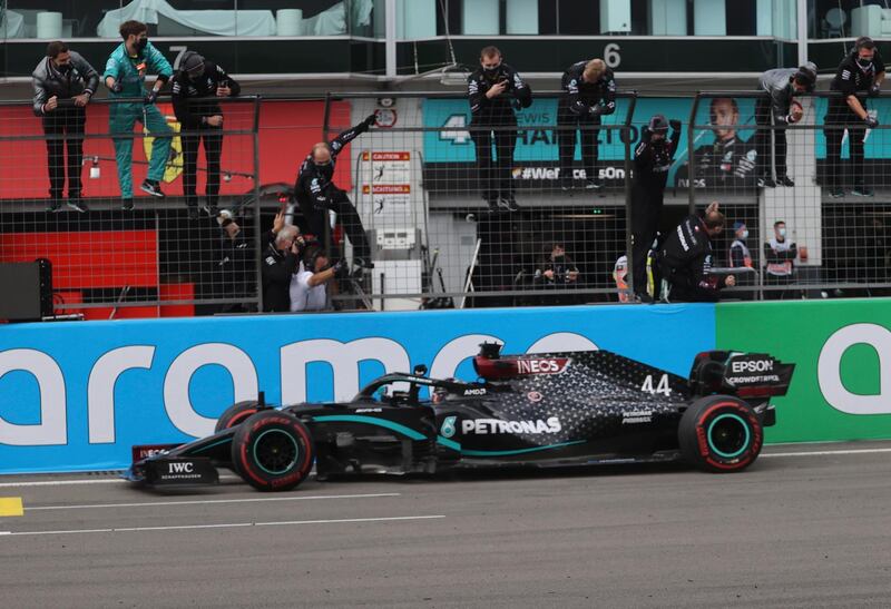Mercedes pit crew celebrate British driver Lewis Hamilton winning the Eifel Grand Prix at the Nuerburgring circuit. EPA