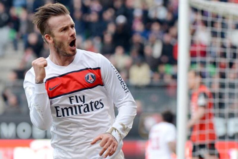 (FILES) In this file picture taken on April 6, 2013 Paris Saint-Germain's British midfielder David Beckham celebrates after making a decisive pass to teammate Swedish forward Zlatan Ibrahimovic allowing him to score during the French L1 football match Rennes vs Paris Saint-Germain at the Route de Lorient stadium in Rennes, western France.  David Beckham is set to retire from professional football at the end of the current season it was announced on May 16, 2013. AFP PHOTO / DAMIEN MEYER

