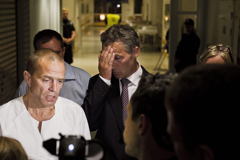 Norwegian Prime Minister Jens Stoltenberg, center, gestures as an unidentified doctor speaks during a press briefing at the Ulleval University hospital in Olso, Norway Saturday July 23, 2011. A Norwegian dressed as a police officer gunned down at least 84 people at an island retreat, police said Saturday. Investigators are still searching the surrounding waters, where people fled the attack, which followed an explosion in nearby Oslo that killed seven.    (AP Photo/Scanpix/Aleksander Andersen)  NORWAY OUT *** Local Caption ***  Norway Explosion.JPEG-03cdc.jpg