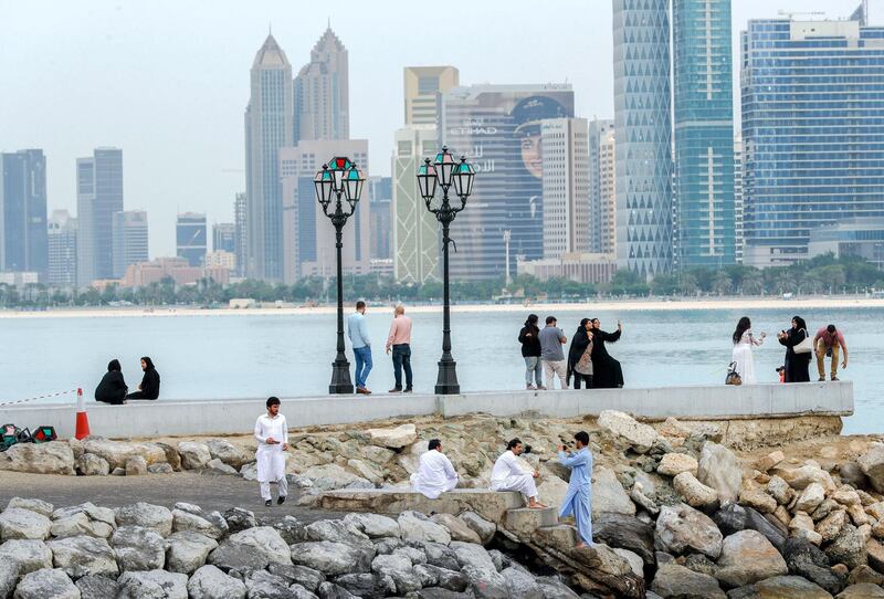 Abu Dhabi, United Arab Emirates, November 10, 2019.  
People enjoying the view of the Corniche after the rains from the UAE fllag.
Victor Besa / The National
Section:  WE
Reporter: