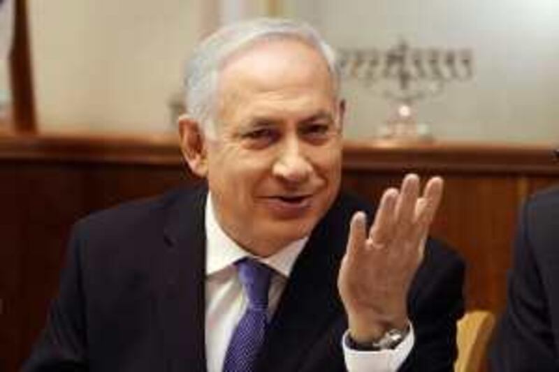 Israel's Prime Minister Benjamin Netanyahu gestures during the weekly cabinet meeting in Jerusalem December 13, 2009. REUTERS/Gali Tibbon/Pool (JERUSALEM - Tags: POLITICS) *** Local Caption ***  JER03_ISRAEL-_1213_11.JPG