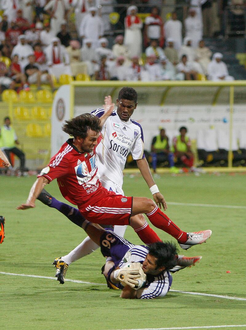 Dubai, United Arab Emirates, Sept 17 2012, Etisalat Cup, Jazira v Al Ain- Al Ain GK  Dawoud Sulaiman makes a stop at the goal crease during action in the Etisalat Cup at Al Wasl stadium. Mike Young / The National?
