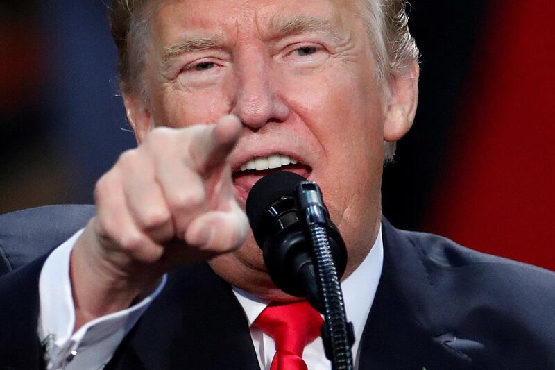 FILE PHOTO - U.S. President Donald Trump speaks at a rally in Pensacola, Florida, U.S., December 8, 2017.  REUTERS/Carlo Allegri/File Picture