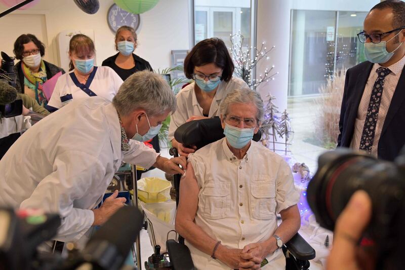 Jacques Collineau, 75, receives a dose of the Pfizer-BioNTech Covid-19 vaccine in Joue-les-Tours, France. AFP