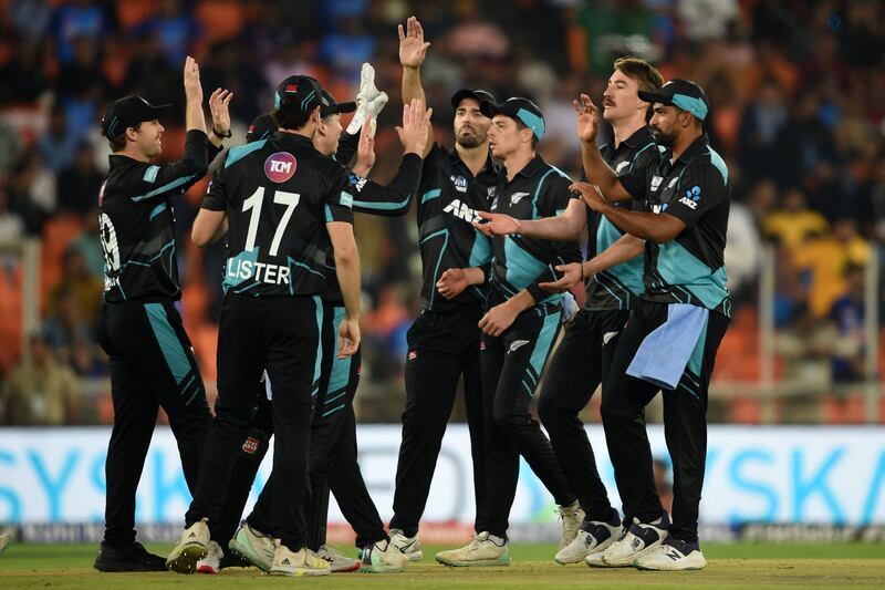 New Zealand's players celebrate after the dismissal of India's Suryakumar Yadav. AFP