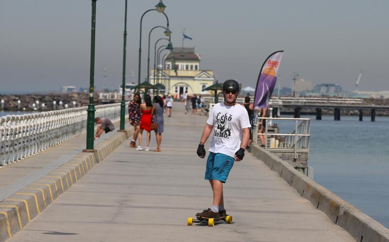 A man skates on a pier at St Kilda beach as a heatwave sweeps across the state of Victoria.  EPA