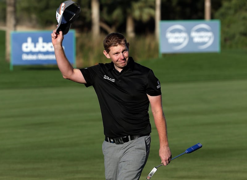 DUBAI, UNITED ARAB EMIRATES - FEBRUARY 03:  Stephen Gallacher of Scotland waves to the crowd on the 18th green on his way to victory in the Omega Dubai Desert Classic at Emirates Golf Club on February 3, 2013 in Dubai, United Arab Emirates.  (Photo by Andrew Redington/Getty Images) *** Local Caption ***  160594094.jpg