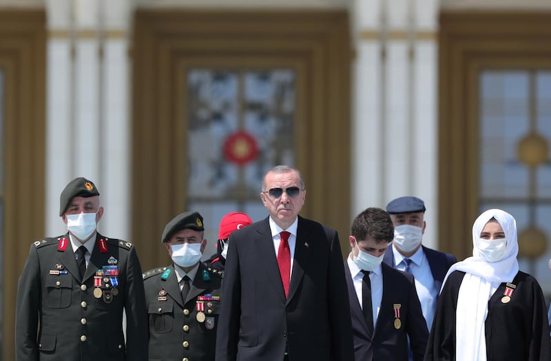 Turkish President Recep Tayyip Erdogan walks to monument of the 15 July martyrs during the fourth anniversary of the failed coup attempt at the Presidential Palace in Ankara, Turkey. EPA
