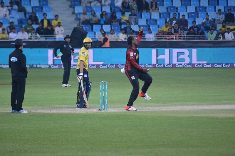 Chris Gayle of Lahore Qalandars bowls against Peshawar Zalmi on Saturday in the Pakistan Super League. Photo Courtesy / PSL