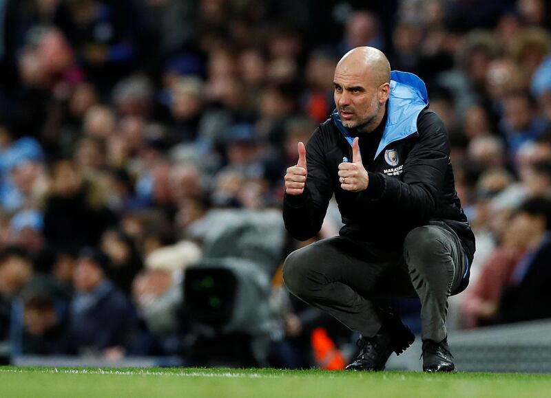 Pep Guardiola gives his players the thumbs up. Reuters