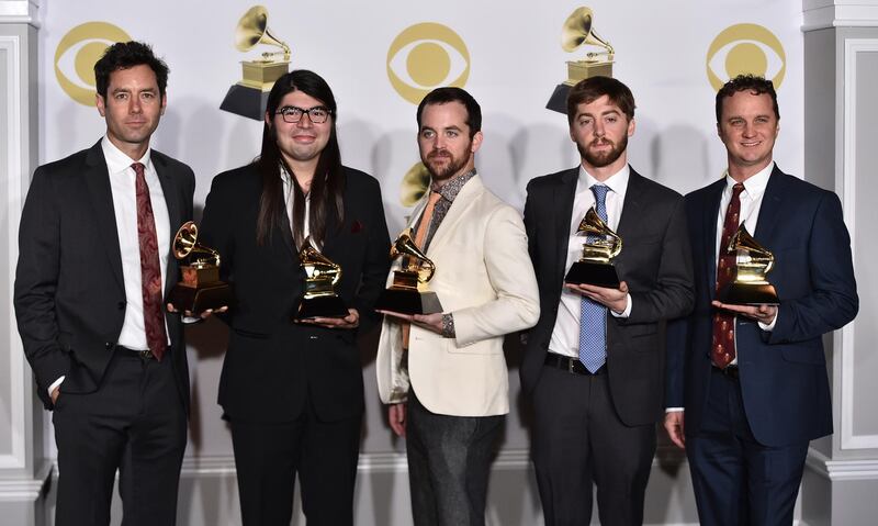 The Lost Bayou Ramblers pose with the best regional roots music album award for "Kalenda" in the press room. Charles Sykes / Invision / AP